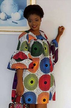 Ankara dress is a type of dress that is made from Ankara fabric, which is a colorful cotton fabric with various patterns and designs. Ankara fabric is also known as African wax print, Dutch wax, or African print1. Ankara dress is popular among African women, especially in Nigeria, Ghana, and other West African countries. Ankara dress can be worn for different occasions, such as weddings, parties, casual outings, and cultural events. Ankara dress can be styled in various ways, such as short dress Multicolor Midi Dress With Vibrant Print, Bohemian Multicolor Print Midi Dress, Colorful Pattern Multicolor Midi Dress, Bohemian Multicolor Pattern Midi Dress, Multicolor Patterned Midi Dress, Multicolor Cotton Maxi Dress With Floral Print, Multicolor Floral Print Cotton Maxi Dress, Multicolor Bold Print Midi Dress, Multicolor Vibrant Print Dress