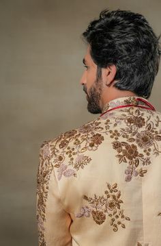 Frosted Almond Sherwani | Jatin Malik Introducing our masterpiece: the golden placement hand-embroidered sherwani. This exquisite sherwani showcases an intricate embroidery technique that utilizes various types of dabka and moti. The meticulous placement of these embellishments creates a stunning visual impact, highlighting the craftsmanship and artistry involved. Perfect for making a grand and elegant statement, this sherwani is a true testament to refined luxury and traditional excellence. Included in purchase: Sherwani, Kurta, Churidar Product Specification Color: Golden Fabric: Linen silk Occasion: Engagement, Wedding, Bridal, Reception Style: Sherwani, Kurta, Churidar Care: Dry Clean Work: Hand Embroidery Customization options:Can be customized in any color or style Note: A stylist wi Sherwani Embroidery, Jatin Malik, Indian Wedding Clothes For Men, Golden Fabric, Embroidered Sherwani, Floral Work, Haldi Ceremony, Royal Look, Indian Wedding Outfits