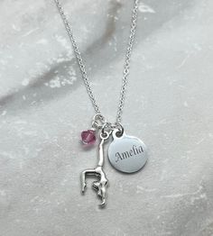 "18 inch silver finished necklace with a 1 inch extender, with an antiqued silver 29mm x 12mm (1.14\" x 0.47\") Gymnast Charm, a 15mm stainless steel name charm of your choice, and a 6mm birthstone crystal of your choice. Makes a great gift for your favorite gymnast!  THE NAME CHARM IS CUSTOM MADE PER ORDER, SO IF YOU NEED TO CANCEL YOUR ORDER IT MUST BE DONE WITHIN 4 HOURS AFTER PLACING YOUR ORDER, AND THEY ARE NOT RETURNABLE. PLEASE ASK ANY QUESTIONS YOU MAY HAVE BEFORE PLACING YOUR ORDER. THA Adjustable Metal Charm Necklaces For Mother's Day, Mother's Day Adjustable Metal Charm Necklaces, Adjustable Stainless Steel Necklace For Mother's Day, Adjustable Silver Charm Necklace For Gift, Adjustable Sterling Silver Round Charm Necklace, Adjustable Round Sterling Silver Charm Necklaces, Adjustable Hypoallergenic Sterling Silver Charm Necklace, Adjustable Stainless Steel Charm Necklace For Mother's Day, Adjustable Hypoallergenic Sterling Silver Necklace