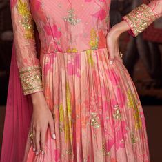 COLOR : Coral Pink FABRIC : Gown - Pure Georgette, Bottom - Mixed Fabric, Dupatta - Net WORK : Resham Embroidery, Zari Motifs, Floral Print, Sequins, Gota Patti, Lace BorderOCCASION : Wedding, Reception, Mehendi, Engagement, Party Wear, Festival READY-TO-WEAR : No STITCHING : Available as semi-stitched fabric, can be stitched using standard size option (+$20). Note: There might be a slight color variation due to lighting and flash used during photoshoot. The bright shade seen is the best closer Pink Chanderi Dress With Intricate Embroidery, Floor-length Chanderi Dress With Floral Embroidery, Fitted Floor-length Sharara With Resham Embroidery, Fitted Anarkali Set With Intricate Embroidery For Festivals, Fitted Georgette Anarkali Set For Reception, Fitted Anarkali Set With Floral Embroidery For Reception, Fitted Floor-length Dupatta With Intricate Embroidery, Floor-length Fitted Dupatta With Intricate Embroidery, Fitted Floral Embroidered Anarkali Set For Reception