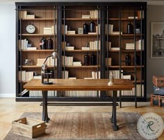 a large bookcase in the middle of a living room filled with books and furniture