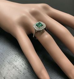 2.00 Carats Natural Emerald and Diamond 14K Solid White Gold Ring Suggested Replacement Value: $4,200.00 Total Natural Green Emerald Weight is: Approx. 1.10 Carats (transparent) Emerald Measures: Approx. 5.70 x 5.70mm Natural Round Diamonds Weight: Approx. 0.90 Carats (color G-H / Clarity SI1-SI2) Ring total weight: Approx. 3.7 grams Disclaimer: all weights, measurements and colors are approximate and may vary slightly from the listed dimensions or as seen in the image. All pictures are magnifie Gia Certified Moissanite Cushion Cut Jewelry, Gia Certified Cushion Cut Moissanite Jewelry, Emerald Cut Gia Certified Halo Ring As Gift, Gia Certified Cushion Cut Fine Jewelry, Gia Certified Emerald Cut Halo Ring As Gift, Exquisite 14k White Gold Gia Certified Diamond Ring, Formal Gia Certified Diamond Halo Ring, Gia Certified Diamond Halo Ring For Formal Occasions, Timeless Gia Certified Halo Ring As Gift