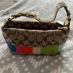 Small Coach Pocketbook. About 15 Years Old Never Used, Looks Brand New! Cute Purse For A Young Girl Getting Into Bags. Multicolor Rectangular Coach Shoulder Bag, Coach Multicolor Shoulder Bag For Everyday, Multicolor Coach Bags With Gold-tone Hardware, Coach Multicolor Bags With Gold-tone Hardware, Multicolor Rectangular Shoulder Bag With Gold-tone Hardware, Coach Edie Shoulder Bag, Coach Parker, Foldover Crossbody Bag, Cute Purse