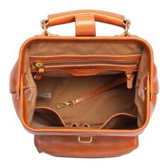 Even the chicest among us encounter circumstances when only a backpack will do. But function and fashion don't have to be mutually exclusive, vegetable-tanned Genuine Leather and Antique Gold Hardware transform our Doctor Backpack from a traditionally utilitarian carryall into a stylish accessory. PRODUCT FEATURES 100% Genuine Leather 100% Recycled Nickle-Free Hardware 100% Interior Cotton Lining 100% Vegetable Base Dyes 100% Handcrafted Push-Lock Clasp Removable Shoulder Straps Adjustable Shoulder Straps Protective Metal Feet Antique Brass Hardware Multi-Pocket Compartments Interior: (1) Zipper Pocket, (2) Slip Pockets, (1) Key Hook Exterior: (1) Front Zippered Pocket PRODUCT DIMENSIONS 10" Width x 12" Height x 5" Depth (Inches) Handle Drop: 2" (Inches) Shoulder Drop: 16"-21" (Inches) STY Leather Backpack With Top Carry Handle, Daily Use Backpack With Leather Top Handles, Travel Backpack With Leather Top Handle, Daily Use Backpack With Top Handle And Leather Handles, Travel Backpack With Leather Handles And Top Handle, Travel Backpack With Top Handle And Leather Handles, Vintage Leather Backpack With Rectangular Shape, Vintage Rectangular Backpack With Leather Lining, Classic Backpack With Detachable Handle For On-the-go