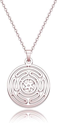 a silver necklace with a circular design on the front and back, hanging from a chain