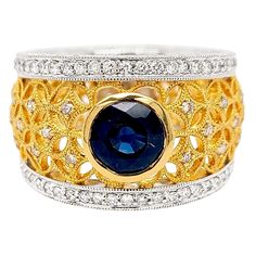 Produced by award winning Italian designer Stefano Vitolo. Stefano creates custom artisanal one of a kind jewelry with excellent gemstones in a truly old world Italian craftmanship. This handcrafted ring has .81 total carat weight of F/G color and VS clarity diamonds. Blue Sapphire Center Stone 1.60 carat. Band width 10-14 mm. Available also in 18 Karat Yellow, White or Pink on request. Luxury Gold Sapphire Fusion Ring, Luxury Collectible Sapphire Ring, Luxury Jewelry With Multi-stone Round Shape, Luxury Multi-stone Round Jewelry, Luxury Round Ruby Ring, Luxury Collectible Sapphire Gemstone Ring, Luxury Sapphire Gemstones With Accent Stones, Unique Yellow Gold Sapphire Ring With Accent Stones, Luxury White Gold Sapphire Ring Collectible