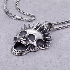 Even the dead have their dose of madness. This punk necklace with an eccentric cut is perfect for those who aren't afraid of other people's gaze! This punk skull necklace is a must for punk people, for people fond of Blink-185 or even Sum 41. As you may have noticed, it is totally painted in silver, making this necklace a unique and really attractive jewel for punk people and their black outfits. Also, as you can see, it has a foxtail bead attached to a screaming skeleton head with punk liberty Gothic Necklace For Halloween Concert, Punk Necklaces For Halloween Concert, Punk Style Necklaces For Halloween Concert, Punk Style Jewelry For Halloween Concert, Alternative Style Necklaces For Halloween, Alternative Halloween Necklaces, Alternative Halloween Necklaces For Alternative Fashion, Alternative Necklaces For Halloween Concert, Emo Necklaces For Halloween And Alternative Fashion