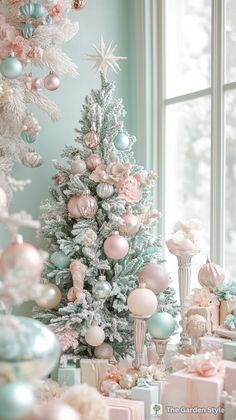 a decorated christmas tree sitting in front of a window next to presents and other decorations