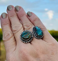 Very unique, one of kind ring. It features 2 gorgeous stones: with one beautifully designed ring shank! These Turquoise Mountain stones stand out above the rest & have such beautiful, rich hues of blues, greens & browns. This ring is a size 7 1/4 & is not very adjustable due to the heavy, solid band. It’s comfortable to wear & is a show stopper! Unique Turquoise Opal Ring With Multi-stone Design, Unique Turquoise Multi-stone Opal Ring, Turquoise Chrysocolla Ring With Large Stone, Large Stone Turquoise Ring In Chrysocolla, Southwestern Chrysocolla Gemstone Rings, Southwestern Turquoise Chrysocolla Ring, Southwestern Chrysocolla Turquoise Ring, Unique Turquoise Chrysocolla Ring, Mountain Ring