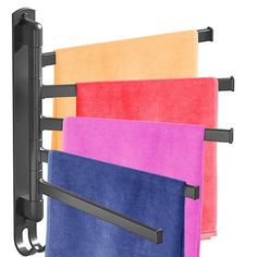 four towels hanging on a towel rack with black metal bars and colored towels in different colors