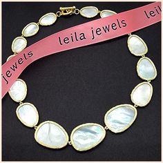 An iconic design, beautiful and timeless. Graduated, irregularly shaped petals of mother-of-pearl, each surrounded by a brushed golden edge. The natural mother-of-pearl nacre has a lustrous sheen that contains a rainbow of colors, changing with the light. Lightweight and delicate, and perfectly proportioned. Toggle clasp for easy on/off. 16" long, with petals that range from 3/4" to 1.25" in length. Imported for the Leila Jewels Glam Collection Elegant Shell Jewelry For Parties, Party Necklace In Mother Of Pearl, Elegant White Hammered Jewelry, Formal Necklace With High Luster Mother Of Pearl, Mother Of Pearl Necklace For Anniversary, Formal Mother Of Pearl Necklace With High Luster, Elegant White Shell Necklace, Formal Gold Mother Of Pearl Jewelry, Elegant Mother Of Pearl Shell Necklaces