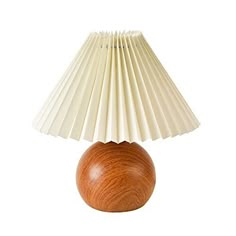 a small wooden table lamp with a white shade on it's top and bottom