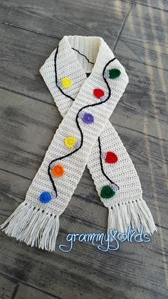 a white scarf with multi colored lights on it