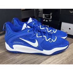 a pair of blue and white nike shoes