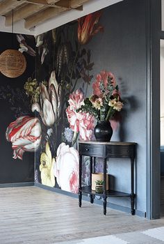 a room with flowers painted on the wall