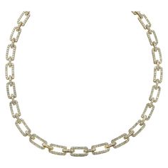 Elegant diamond link necklace, crafted in 14 karat yellow gold, embellished in 541 round brilliant cut diamonds, weighing approximately 12.52 carats total, H-I color, SI clarity. The necklace measures 7.6 mm in width, 17 inches in length, and weighs 33.5 grams. It closes with a hidden box clasp and safety lever. Our pieces are all accompanied by an appraisal performed by one of our in-house GIA Graduates. They are also accompanied by GIA grading report(s), AGL grading report(s), original certifi Luxury Classic Link Diamond Necklace, Gold Luxury Diamond-shaped Necklace, Luxury Yellow Gold Link Diamond Necklace, Luxury Yellow Gold Chain Link Diamond Necklace, Luxury 14k Gold Diamond-shaped Necklaces, Ruby And Diamond Necklace, Diamond Chandelier, Diamond Tennis Necklace, Necklace Craft