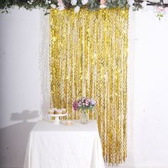 the table is covered with flowers and gold chains