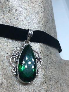 Handmade Vintage Green Glass  Crystal Choker Pendant
https://www.etsy.com/listing/644272871/handmade-vintage-green-glass-crystal Formal Green Engraved Necklace, Vintage Sterling Silver Jewelry For Party, Vintage Sterling Silver Party Jewelry, Green Oval Jewelry For Party, Elegant Engraved Emerald Jewelry, Vintage Gemstone Jewelry For Party, Vintage Hallmarked Emerald Jewelry, Antique Silver May Birthstone Jewelry, Elegant Green Jewelry With Large Pendant