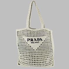 Prada Handbag In A Mint Green Raffia Featuring A Crochet Woven Design With Black Prada Logo, And Tote Bag Style. Made In Italy.Very Good Pre-Owned Condition. Measurements: Length: 14 Inches Width: 1.25 Inches Height: 14 Inches Drop: 10 Inches Sui Generis Reference: 133050 Category: Handbag & Leather Goods More Details Brand: Prada Color: Green Color 2: Mint Pattern: Crochet Material: Raffia Style Bag: Tote Age Group: Adult Made In: Italy Sui Generis Designer Consignment Is An Award Winning Fashi Designer Rectangular Crochet Bag For Beach, Designer Crochet Rectangular Bag For Beach, Designer Natural Color Rectangular Crochet Bag, Designer Crochet Bag For Summer, Designer Natural Rectangular Crochet Bag, Designer Crochet Rectangular Beach Bag, Designer Rectangular Crochet Beach Bag, Designer Rectangular Natural Crochet Bag, Designer Crochet Bag For Summer Shopping