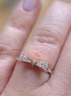 Metal: 14K Rose Gold Weight: 2.5 grams Stone Type: Diamonds Stone Shape: Round Diamond Weight: .32 Carats Size: 7 Sizing: This ring can for sure be sized up to 2 sizes up or down. Beyond that we might need to custom make the ring to your size. It can be made at any size. Please state size in size box, or contact us if needed. Customization: This ring can be custom made with any gems and metals of your choice. Please inquire. Design Element: Bow Matching Necklace: https://www.etsy.com/listing/205 Luxury 14k Rose Gold Rings For Gift, 14k Rose Gold Diamond Ring For Formal Occasions, 14k Rose Gold Jewelry With Pave Setting, Rose Gold Sterling Silver Diamond Cut Ring, Rose Gold Jewelry With Pave Setting In Cubic Zirconia, Luxury 14k Rose Gold Jewelry With Prong Setting, Formal 14k Rose Gold Diamond Ring In Gold, Rose Gold 14k Jewelry With Pave Setting, Formal 14k Rose Gold Diamond Ring