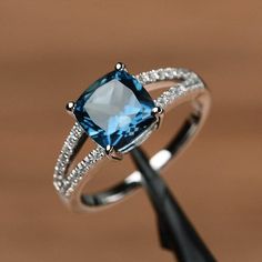 London blue topaz ring cushion cut gemstone promise sterling silver ring blue gemstone ring Elegant Rings, Blue Gemstone Rings, Ring Cushion, Gold Diamond Wedding Band, London Blue Topaz Ring, Engagement Ring White Gold, Morganite Engagement Ring, Rose Engagement Ring, Blue Gemstones