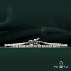 This elegant and classic tennis bracelet features 1.09 ctw round diamonds, set delicately in a secure four prong setting. Its dainty design adds a touch of sophistication and offers a timeless accessory for any occasion.  BRACELET INFORMATION: * Metal Type: 14K White Gold * Metal Weight:  3.7 grams DIAMOND INFORMATION: * Type: Lab-Grown Diamond * Diamond Shapes:  Round * Carat Total Weight: 1.09 ct. * Stone Quantity: 105 * Diamond Color: F * Diamond Clarity: VS --- YOUR ORDER INCLUDES--- ◆ Certi Classic Moissanite Tennis Bracelet For Wedding, Elegant Moissanite Tennis Bracelet, Classic Moissanite Tennis Bracelet, Classic Moissanite Tennis Bracelet For Anniversary, Elegant Moissanite Tennis Bracelet For Anniversary, Diamond Tennis Bracelet, Wedding Jewelry Bracelets, Tennis Bracelet Diamond, Timeless Accessories