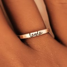 This personalized stacking ring features a unique and stylish handwriting font or serif font, adding a personal touch to your jewelry collection. Handmade with care, each ring is crafted with 14k gold filled or fine silver materials for a luxurious look and feel. Make a statement with this modern and customizable piece. Simple Personalized Initial Ring For Everyday, Minimalist Hand Stamped Stackable Rings As Gift, Minimalist Hand Stamped Stackable Rings For Gift, Minimalist Hand Stamped Midi Rings, Minimalist Personalized 14k Gold Engraved Ring, Minimalist 14k Gold Engraved Personalized Ring, Personalized Minimalist 14k Gold Engraved Ring, Minimalist Engraved 14k Gold Ring, Minimalist Personalized Engraved 14k Gold Ring