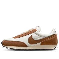 The Nike DBreak SE 'Rattan' is a stylish and comfortable women's sneaker that combines a classic running style from 1979 with modern materials. Its unique silhouette and texture make it stand out from the crowd. It is perfect for running, jogging, and other activities, and its brown and white colorway is inspired by the classic Nike Daybreak series. The rubber sole provides superior cushioning and support, making it a great choice for any woman who wants to look stylish while staying active. Release date: 2022-06-27. (SNKR/Retro/Low Top/Women's) Sporty Brown Sneakers With Rubber Waffle Outsoles, Vintage Nike Sneakers With Boost Midsole, Vintage Nike Sneakers With Boost Technology, Nike Retro Sneakers With Boost Midsole, Nike Brown Low-top Running Shoes, Retro Nike Sneakers With Rubber Sole, Sporty Brown Nike Running Shoes, Casual Brown Running Shoes With Rubber Waffle Outsoles, Nike Brown Sneakers With Rubber Waffle Outsoles