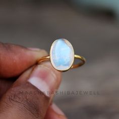 Natural Moonstone Ring, Solitaire Engagement Ring, 18k Gold Vermeil Ring, Birthstone Ring, Rainbow Moonstone Ring, Dainty Weeding Women Ring SHOP LINK:- https://www.etsy.com/shop/MaaShabashibaJewell?ref=seller-platform-mcnav 》D E T A I L S《 Gemstone: Natural Rainbow Moonstone Gem Color: Blue Stone Shape: Oval Metal: 925 Sterling Silver Purity: 925 Parts Per 1000 Setting Type: Bezel Set Silver Polish: High Ring Size: All Size Available Please note that there Can be slight variations in stone text Luxury Gift Moonstone Open Ring, White Moonstone Ring With Bezel Setting In 14k Gold, White Moonstone Celestial Ring In 14k Gold, White Celestial Moonstone Ring In 14k Gold, Minimalist White Moonstone Ring For Anniversary, Delicate White Moonstone Gemstone Ring, Delicate White Moonstone Ring, Celestial Stackable Moonstone Ring For Anniversary, 14k Gold White Moonstone Oval Cabochon Ring