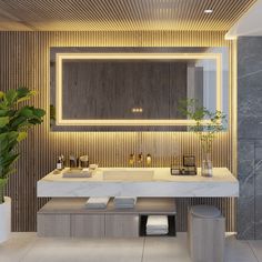 a modern bathroom with marble counter tops and gold accents on the wall, along with two planters