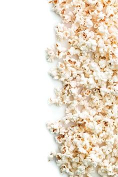 a pile of popcorn sitting on top of a white table