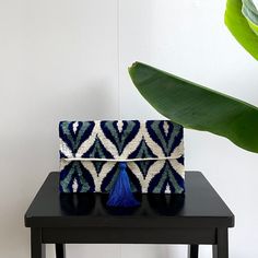 "- SOLD OUT - Mila∞Miro by Emelie * Chic clutch bag in handloomed fabric * Lightweight, soft and suitable for phone, keys, purse * Made of 100% silk velvet ikat * Magnetic snap closure, silk tassel * Can be ordered without or with chain (110 cm) * Size 17x30 cm / 6.7\"x11.8\" * Worldwide delivery within 1 week * Free shipping! Kindly note: - These bags are made-to-order. Position of pattern can differ from product pictures displayed. Colors in reality may also differ a bit depending on angle, li Beaded Pouch, Fabric Designs, Envelope Bag, Ikat Fabric, Beaded Clutch, Beaded Bags, Silk Velvet, Product Pictures, Picture Display