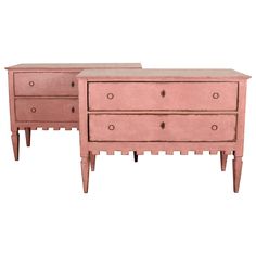 two pink dressers sitting next to each other