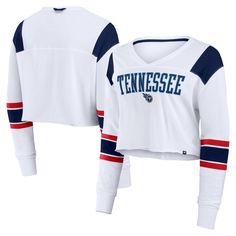 Add some modern style to your Tennessee Titans game day look with this Stretch Cropped Fashion Long Sleeve T-Shirt from Fanatics. This stylish top features an embroidered applique team logo and a tackle twill team wordmark on the chest for a spirited look that shows off your Titans pride. The oversized fit and cropped design elevates your style, making it perfect for game day or a casual outing. College Sports Season Fan Apparel Tops, Game Day Fan Apparel Tops With Crew Neck, Collegiate Long Sleeve Tops For Game Day, Collegiate Style Long Sleeve Tops For Game Day, Sporty Long Sleeve Top For Game Day, Game Day Crew Neck Top With Team Name, Varsity Tops With Team Logo For Fan Gear, Fan Apparel Tops With Team Name For Sports Season, Varsity Tops With Team Name For Fan Gear