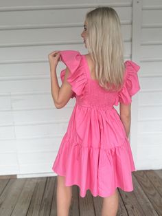 Adorable flowy pink babydoll dress with ruffle sleeves. Model is 5'4" with a 25" waist, 32" bust, and 32" hips wearing a small. Cute Ruffled Puff Sleeve Dress, Feminine Tiered Puff Sleeve Dress With Ruffles, Spring Ruffle Sleeve Dress With Smocked Back, Cute Puff Sleeve Dress With Ruffles, Pink Ruffled Dress With Short Sleeves, Cute Pink Dress With Ruffled Skirt, Pink Short Sleeve Dress With Ruffles, Cute Mini Dress With Ruffle Sleeves, Summer Billowy Puff Sleeve Dress With Ruffles