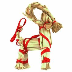 a toy horse made out of sticks with red ribbon around it's neck and tail