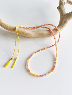 A colourful double wrap seed bead bracelet with pink, orange, yellow and purple seed beads on a yellow silk cord with a gold filled slider bead and accents. Inspired by the beautiful colours of a sunset every bracelet is unique as the beads are a random mixture of these colours. Delivered in our pretty gift box, so fantastic as a present for a friend or to yourself! Shipping Uk: 2-3 days - Royal Mail 48hr tracked International standard delivery: 6- 14 days (delays can occur especially in busy periods) Please be aware that standard shipping is UNTRACKED and does not need to be signed for but you do have the option to upgrade to tracked and signed shipping (someone must be available to sign for the parcel on delivery) International orders over £50 will automatically be upgraded to tracked an Bracelet Styles, Pink Orange Purple, Pink Orange Yellow, Necklace Ideas, Seed Bead Bracelet, Yellow Silk, Yellow And Purple, Beaded Wrap Bracelets, Silk Cord