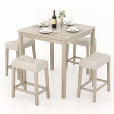 Upgrade your dining space with this stylish 5-piece dining set, ideal for small apartments, kitchens, or breakfast nooks. Featuring a compact square table and 4 padded stools, this set comfortably seats 4 while maximizing your living area. With its solid rubber wood legs, the kitchen table set is built to last, offering reliable support for everyday use. The table features a spacious MDF tabletop, adding a sleek look that resists scratches and spills for easy maintenance. The comfortable stools Bar Table And Chairs, Small Kitchen Table Sets, Aesthetic Highlights, Stool Storage, Waterproof Wood, Padded Stool, Small Kitchen Tables, Kitchen Table Chairs, Bar Table Sets