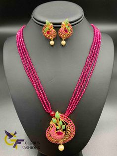 Cute multicolor stones Peacock design pendant with matching pink beads chain Handmade jewelry One gram gold jewelry Silver-plated jewelry Official Website globusfashions.com 🌸 S H O P . M O R E . S T Y L E S 🌸 https://www.etsy.com/shop/Globusfashions Necklaces - https://www.etsy.com/shop/Globusfashions?section_id=18712263 Bracelets - https://www.etsy.com/shop/Globusfashions?section_id=18969767 Pendant Sets - https://www.etsy.com/shop/Globusfashions?section_id=18707402 Tikka - https://www.etsy. Peacock Design Pendant Necklace For Celebration, Pink Gemstone Beads Necklace For Wedding, Festive Pink Jeweled Jewelry, Festive Pink Necklace For Party, Festive Pink Party Necklace, Celebration Jeweled Round Bead Necklaces, Jeweled Round Bead Necklaces For Celebration, Multicolor Peacock Design Necklace For Diwali, Temple Jewelry Necklaces With Colorful Beads For Celebration