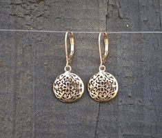 "14k Gold dangle earrings, Filigree Round mandala earrings, beautiful and delicate ethnic earrings.  Gorgeous, solid gold bohemian earrings with a dangling domed circle. The circle is designed as a delicate mandala with spiraling floral motifs. These unique, Indian style, handmade earrings are part of my ethnic jewelry collection. These lightweight and delicate 14k gold drop earrings will become your favorite go-to accessory for every occasion. Get these earrings for yourself or as a meaningful Elegant Yellow Gold Medallion Earrings, Elegant Engraved 14k Gold Earrings, Pendant Earrings With Intricate Design In Yellow Gold, Gold Pendant Earrings With Elegant Design, Fine Jewelry Dangle Earrings With Filigree, Fine Jewelry With Filigree Dangle, Yellow Gold Pendant Earrings With Intricate Design, Rose Gold Sterling Silver Filigree Jewelry, Antique Pierced Round Jewelry