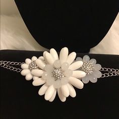 Beautiful White Flower Bracelet Has Three Flower On It With Gems Bling Bling Inside This Bracelet Would Be Great For Any Summer Outfit White Jewelry With Flower Decoration For Party, White Party Jewelry With Flower Decoration, White Flower Decorated Jewelry For Parties, Adjustable White Jewelry With Flower Decoration, Adjustable White Bracelet With Flower Decoration, White Flower Jewelry For Party, White Flower Charm Bracelet For Wedding, White Wedding Bracelets With Flower Charm, White Wedding Bracelet With Flower Charm