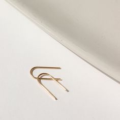 Simple and effortless, yet anything but basic, our 14k gold Arches minimal design means endless wear for everyday style. A great earring for sensitive ears and a must-have addition to your fine jewelry collection. DETAILS14k Solid GoldApprox. 0.5" dropHypoallergenic, Nickel Free and Water Safe Classic Everyday Hoop Earrings In Recycled Gold, Minimalist 14k Gold Jewelry For Everyday, Simple Design 14k Gold Earrings, Everyday Single Earring In Recycled Gold, Minimalist Yellow Gold Hoop Earrings, Minimalist Sterling Silver Tarnish Resistant Threader Earrings, Modern Everyday Earrings In Recycled Gold, Minimalist Sterling Silver Tarnish-resistant Threader Earrings, Minimalist 14k Gold Hoop Earrings For Everyday