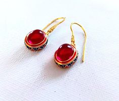 Golden plated Earrings Red Carnelian Gem. Coloured Cloisonne enameled. High quality.    Handmade ethnic antique design egyptian style ring Metal Type - 18k Gold plated Gem Colour - Red The earrings are delivered with a jewelry box.  Combined shipping! Handmade Red Enamel Jewelry, Red Vintage Earrings For Festivals, Festive Red Brass Earrings, Ornate Red Cabochon Jewelry, Traditional Red Enamel Jewelry, Traditional Red Oval Jewelry, Red Enamel Jewelry With Gemstone, Red Gemstone Jewelry With Enamel, Ornate Red Earrings For Festivals