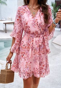 Flirty, flowy, and fabulously femme, our Sienna Floral Wrap Mini Dress is a must-have for any fashion-forward babe. Made with lightweight chiffon fabrication, this dress will keep you cool and chic all season long. Embrace your inner flower child with this playful and versatile piece. Size Guide: Model is 5’8” tall, and has a 33.4” bust, 26.4” waist, & 35.4” hips. She is wearing a S / US 4 / AU 8. This dress is true to size. Material: 100% Polyester. Feature: V-Neckline. Wrap front with waist tie. Short ruffle sleeves. Floral Print. Chiffon Fabrication. Mini length. Care Instructions: Machine wash / Cold hand wash Floral Flowy Dress Short, Flowy Dress Short, Flowy Floral Dress, Wrap Mini Dress, Floral Print Chiffon, Floral Wraps, Daily Dress, Dress Jewelry, Pink Mini Dresses