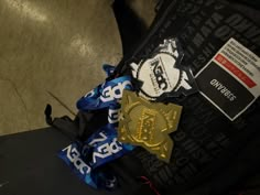 an award is placed on the back of a suitcase with ribbon around it and another medal