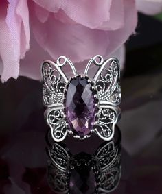 Elevate your jewelry collection with our stunning handmade Filigree Art Silver Butterfly Ring featuring an Amethyst Gemstone, the February birthstone. Crafted from 925 sterling silver, this timeless cocktail ring is both delicate and eye-catching, with a ring face length of 0.80 inches and a width of 0.70 inches. The amethyst gemstone is a 7x14 mm double-sided faceted checkboard oval cut, adding a touch of elegance to this already stunning piece. Plus, the metal embroidery filigree is oxidized a Silver Butterfly Ring, Metal Embroidery, Boho Butterfly, Floral Filigree, Silver Cocktail, Art Butterfly, Filigree Jewelry, Butterfly Ring, Statement Ring Silver