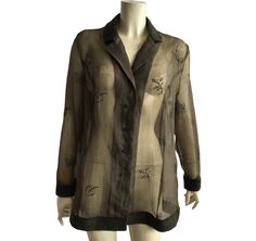 Gorgeous vintage sheer embroidered shirt in khaki color . The collar , cuffs and the end of the shirt are made from wool . Labeled as GB 20, IT 52, D 46 , fits like XL , but looks great oversize for smaller sizes . Chest 118 cm / 46 inches, length 76 cm / 29,9 inches . Material tag is missing . Perfect condition Sheer Long Sleeve Shirt For Work, Sheer Long Sleeve Shirt For Fall, Sheer Sleeves Button-up Tops For Fall, Fall Sheer Sleeves Button-up Tops, Sheer Button-up Top For Fall, Summer Button-up Top With Sheer Sleeves, Fall Button-up Top With Sheer Sleeves, Elegant Long Sleeve Shirt With Floral Embroidery, Formal Long Sleeve Sheer Shirt