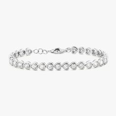 Heads will turn when wearing the exquisite Harley Diamond Tennis Bracelet. A unique take on a classic tennis bracelet, this stunning style is a must have! Metal: 14k White Gold / 14k Yellow Gold Round Brilliant Cut Natural Diamonds: Approx. 2.17 ctw G/H Color and SI1-2 Clarity Diamonds Length: 7 inches at the longest Features 6 inches of bezeled diamonds + 1 inch of jump rings for versatile wear between 6"-7" Closure: Lobster clasp Looking for a different size? Please email us. Elegant Heart-shaped Brilliant Cut Diamond Bracelet, Classic Round Diamond Heart Bracelet, Classic Diamond Heart Bracelet, Classic Diamond Heart Bracelet In White Gold, Classic White Gold Diamond Heart Bracelet, Elegant Cubic Zirconia Heart Bracelet With Jubilee Band, Fine Jewelry White Gold Heart Bracelet With Cubic Zirconia, Heart Cut Brilliant Bracelets For Anniversary, Elegant Heart-shaped Tennis Bracelet With Diamond Accents