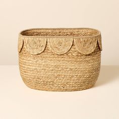 a large woven basket with scalloped edges