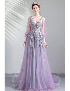 Fitted Tulle Dress With Long Sleeves, Fitted Long Sleeve Tulle Dress, Long Sleeve Tulle Gala Dress, Long Sleeve Tulle Dress For Gala, Tulle Long Sleeve Dress With Sweep Train, Long Sleeve Tulle Dress With Sweep Train, Long Sleeve Purple Gown For Banquet, Purple Long Sleeve Gown For Prom Season, Purple Long Sleeve Banquet Gown